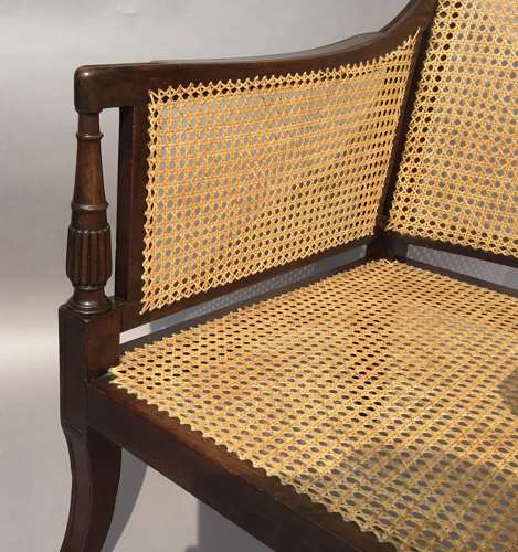 A splendid Regency mahogany bergere library chair