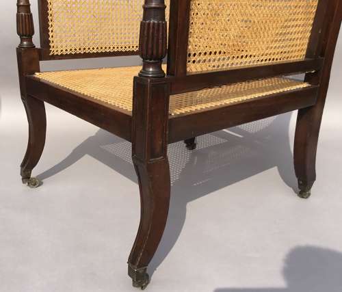 A splendid Regency mahogany bergere library chair