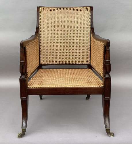 A splendid Regency mahogany bergere library chair