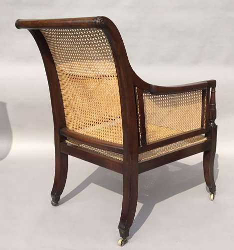 A splendid Regency mahogany bergere library chair