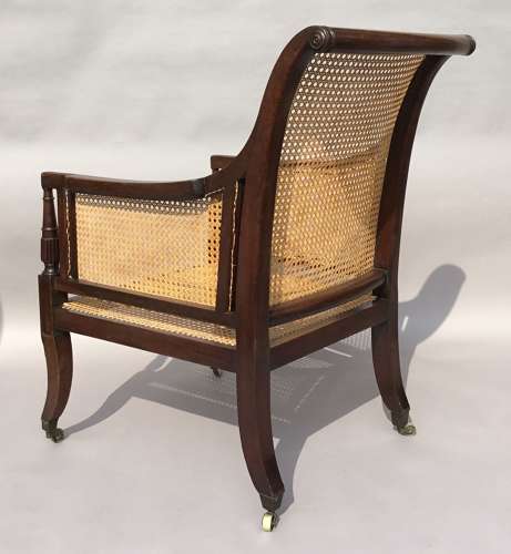 A splendid Regency mahogany bergere library chair