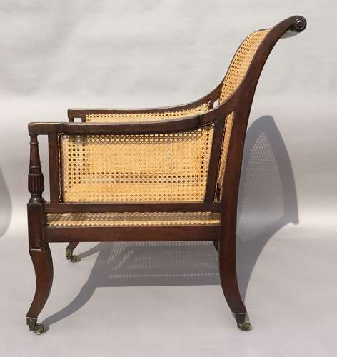 A splendid Regency mahogany bergere library chair