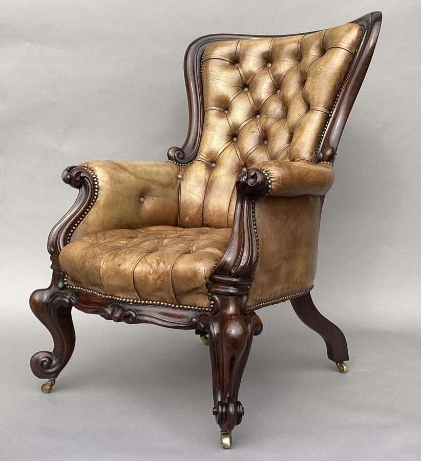 Impressive mid C19th carved mahogany library armchair