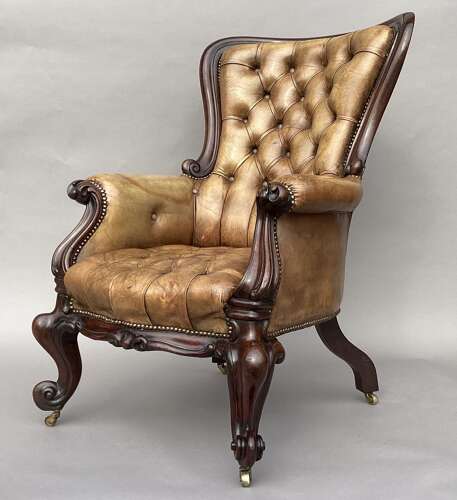 Impressive mid C19th carved mahogany library armchair