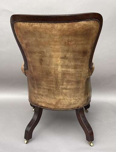 Impressive mid C19th carved mahogany library armchair